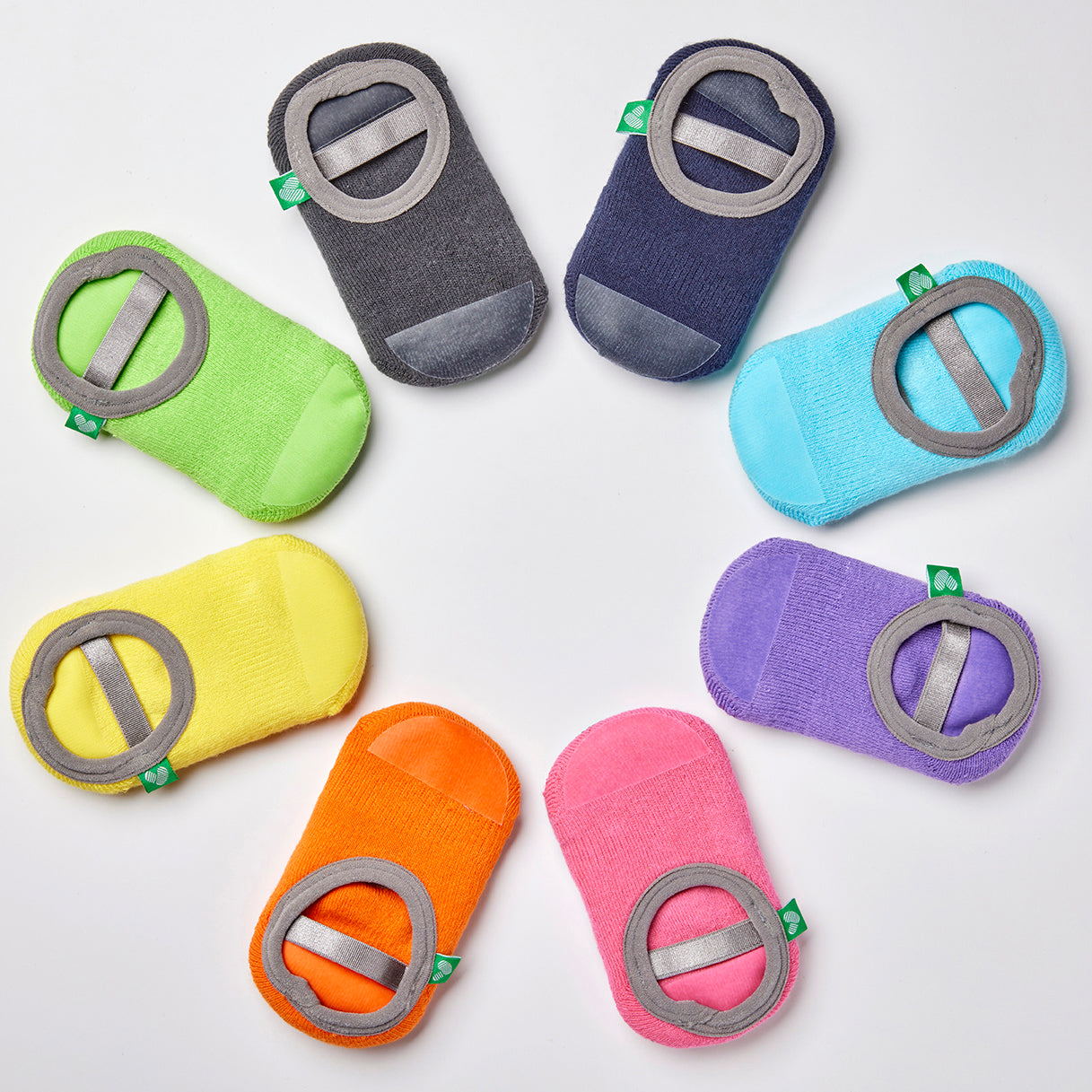 Set of colorful baby non-slip socks on a white background